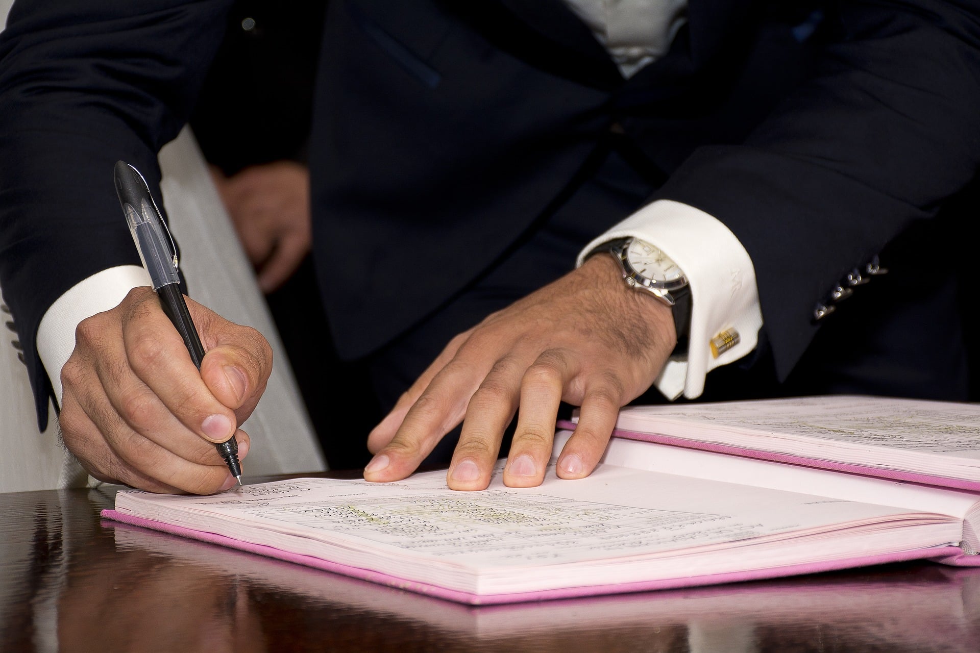 Man Signing Prenuptial Agreement