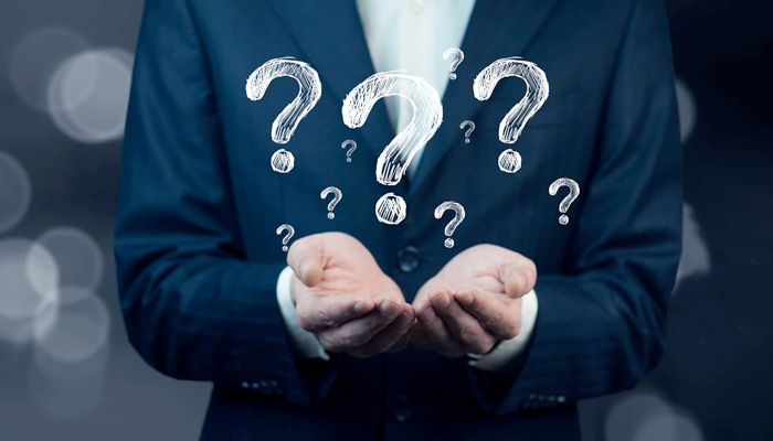 Businessman hand hold interface question marks