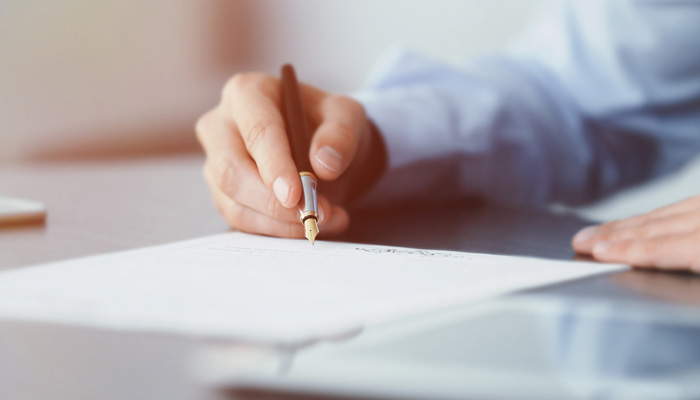 Businessman signing documents