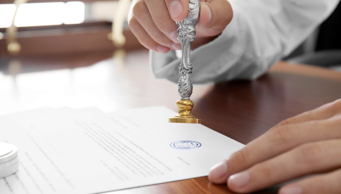 Notary public in office stamping document