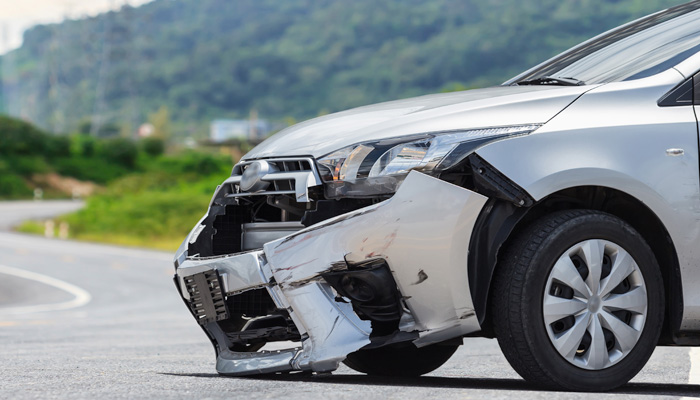 Silver car get damaged by crash accident on the road