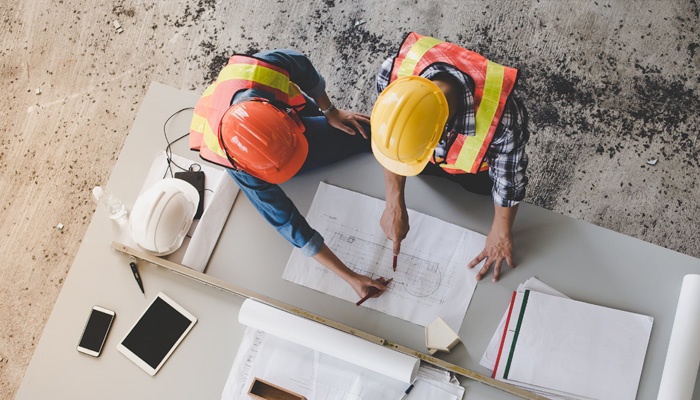 Top view of architects and engineers to help create a blueprint