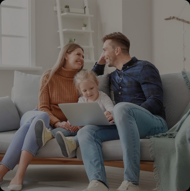 a mom, dad and toddler on the couch
