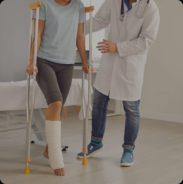 a person on crutches being helped by a doctor
