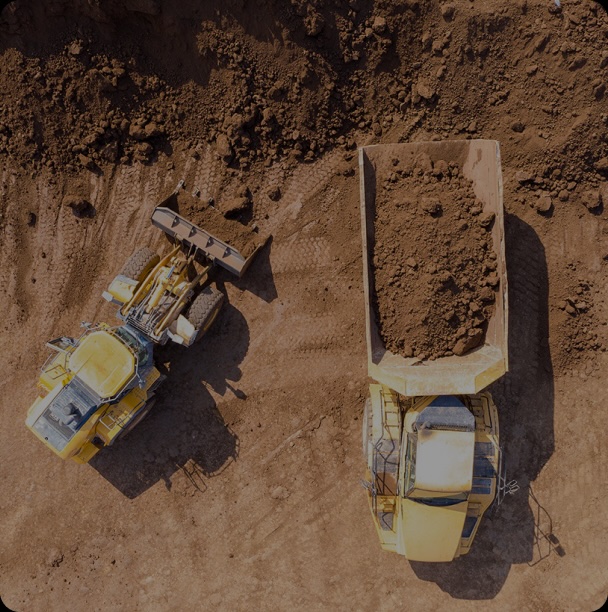 two construction vehicles on a construction site