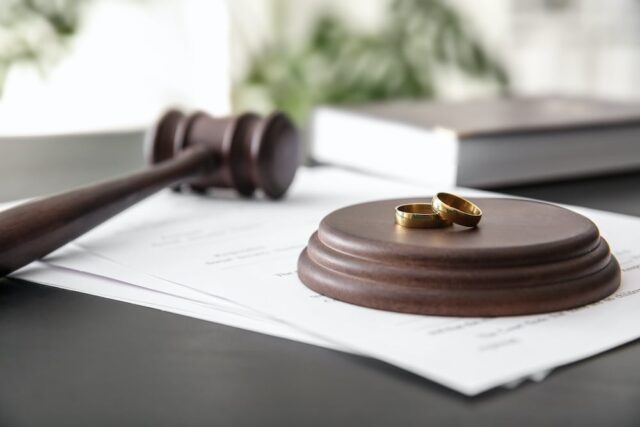 gavel next to wedding rings