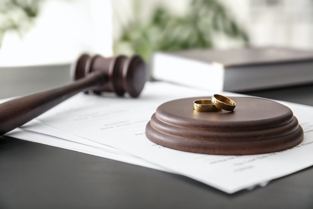 gavel next to wedding rings