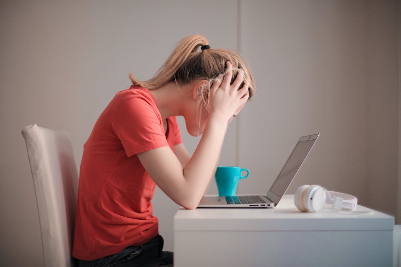 woman stressed at her laptop